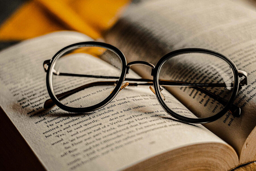 eye glasses resting on book